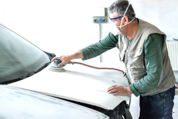 istock Spray car painter  with a polisher 1158494669