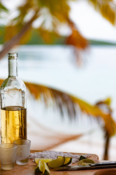istock tequilla with lime on a tropical beach in the caribbean 1158495439