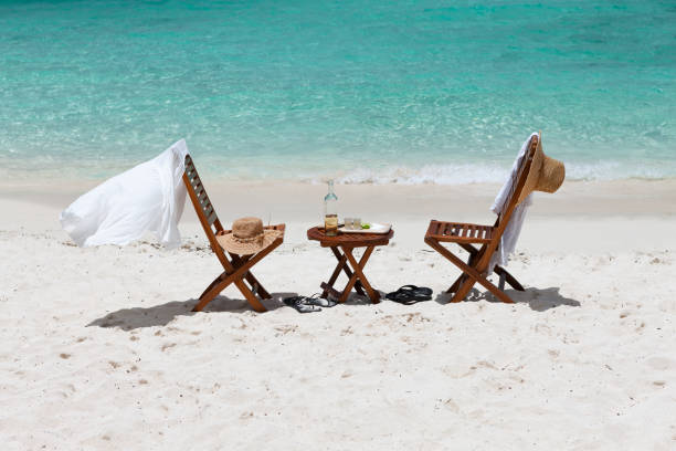 istock Beach chairs and tequilla on a tropical beach 1158495633