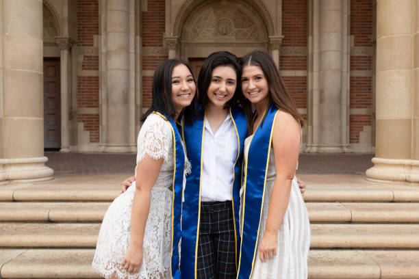 istock Three Female College Graduates Wearing Their Sashes 1158495717