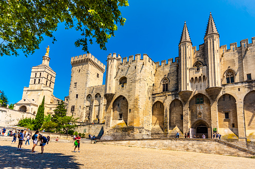 Avignon, Provrnce-Alps-Cote d'Azur, France -  June 1, 2019: View of the Palace of the Popes, monument in gothic style World Heritage Site.