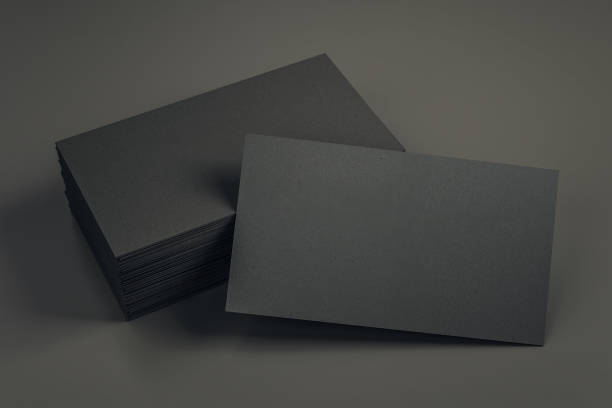 istock Empty black business cards on desk 1158502486