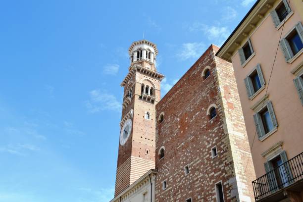 istock Dei Lamberti medieval tower decorated with ancient mechanic clock. 1158504385