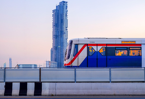 Bangkok-Thailand NOV 12 2018: BTS SkyTrain on cityscape background on evening time and afterwork, BTS SkyTrain is a mass transit system in Bangkok to help facilitate and speed the journey.