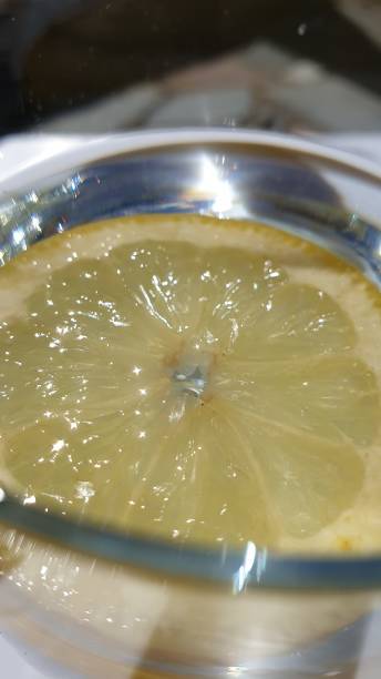istock Lemon slice in glass of water 1158506222