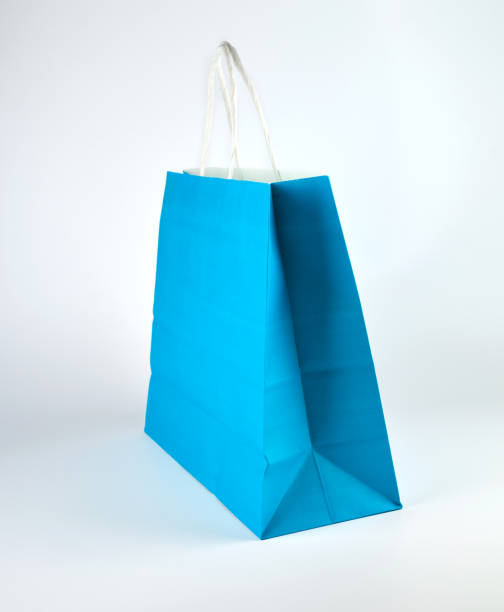 istock blue paper shopping bag with a handle 1158506987