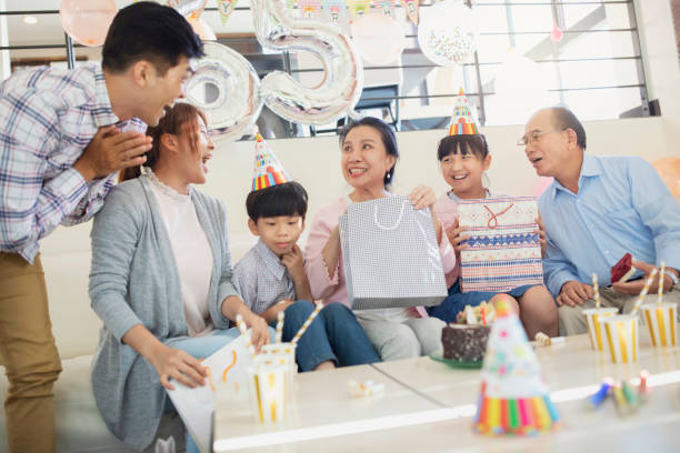 istock Opening up birthday presents 1158507697