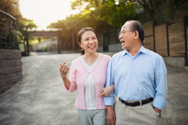 istock Elderly couple enjoying a walk 1158507926