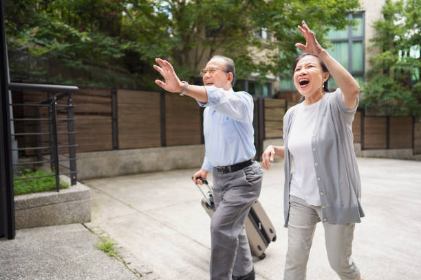 istock Senior couple waving goodbye 1158507977