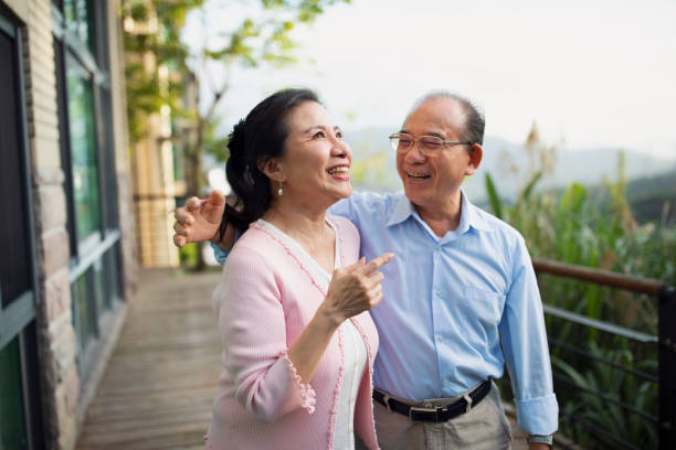 istock Elderly couple having a good time on balcony 1158508565