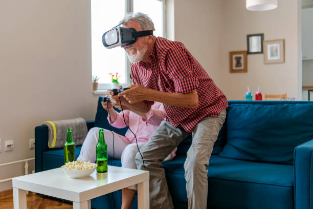 istock Mature couple playing virtual reality games. Virtual Reality Simulator. 1158508667
