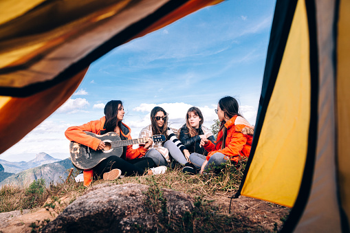 Group of young friends camping on the mountain