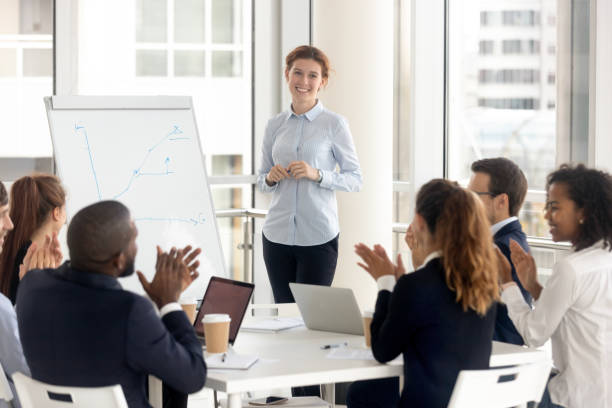istock Diverse employees applaud thanking coach for training 1158514079