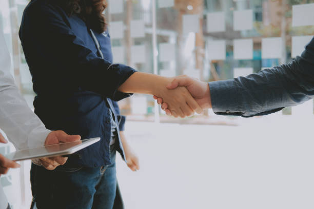 istock Business people shaking hands after meeting. colleagues handshaking. teamwork partnership concept. 1158514347