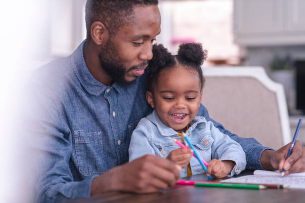 istock Father coloring with his daughter 1158514518
