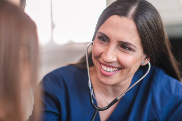 istock Female pediatrician with patient 1158514548