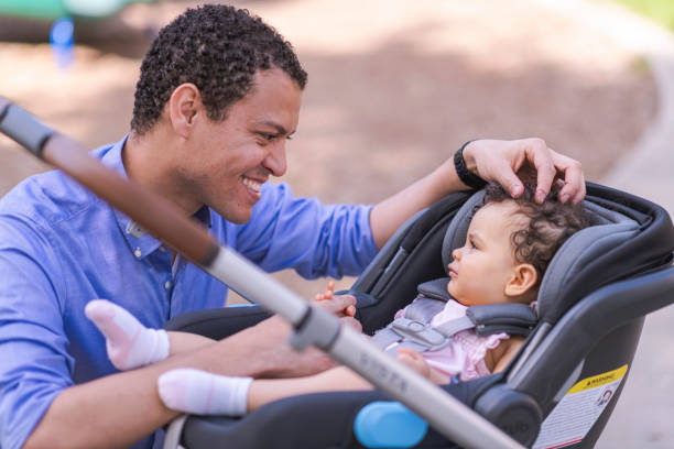 istock Father takes baby daughter on a walk 1158514564