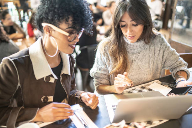 istock Women working and using laptop at restaurant 1158516677