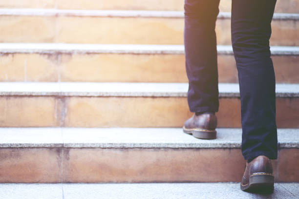 modern businessman working close-up legs walking up the stairs in modern city. in rush hour to work in office a hurry. During the first morning of work. stairway. soft focus. modern businessman working close-up legs walking up the stairs in modern city. in rush hour to work in office a hurry. During the first morning of work. stairway. soft focus. urban dictionary stock pictures, royalty-free photos & images