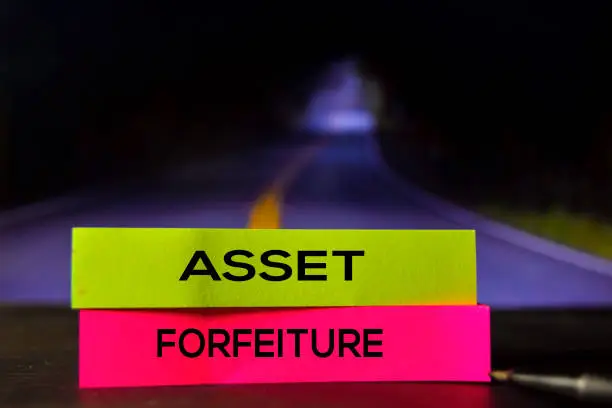 Photo of Asset Forfeiture on the sticky notes with bokeh background