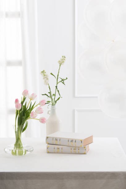 istock Beautiful Books and flowers on table 1158520912