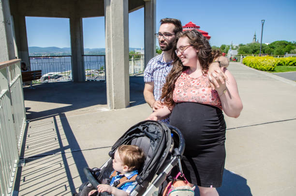 istock Young couple with baby stroller 1158520988