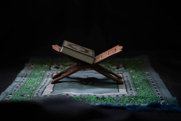 istock Quran - Muslim holy book placed on a wooden board 1158525974