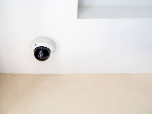 istock CCTV system security. Round CCTV camera on ceiling in the corner of the walkway in condominium 1158528808