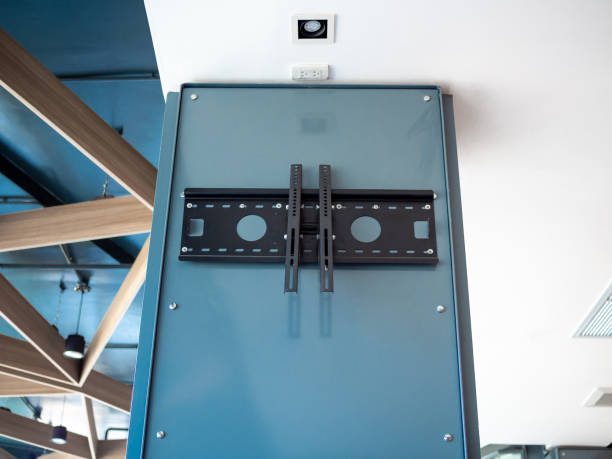 istock Black TV wall mount on blue steel pillar 1158528894