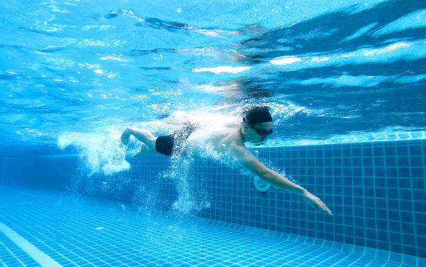 istock Underwater angle picture Men exercise Freestyle Swimming, 1158529793