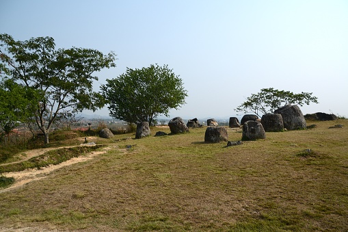 The Plain of Jars, a megalithic archaeological site in Laos., consisting of thousands of stone jars scattered around the upland valleys of the Xiangkhoang Plateau, located at the end of the Annamese Cordillera, the principal mountain range of Indochina. The Plain of Jars is dated to the Iron Age and is one of the most important prehistoric sites in Southeast Asia.