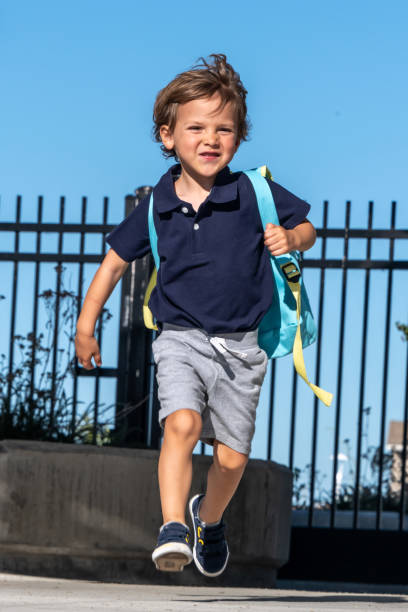 back to school, little boy child running to his first day of school - little boys preschooler back to school backpack imagens e fotografias de stock