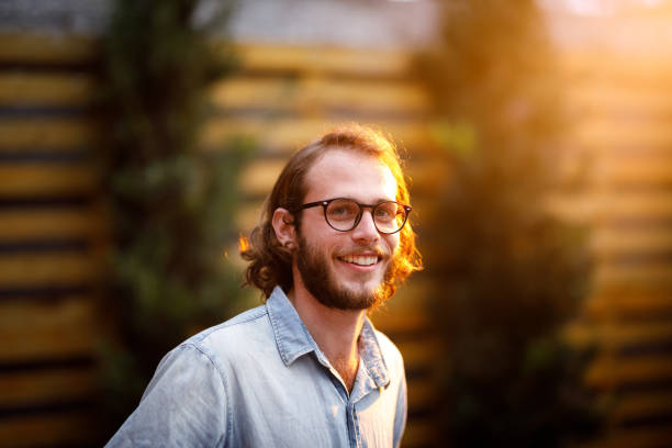 istock Man with long hair wearing glasses 1158538130
