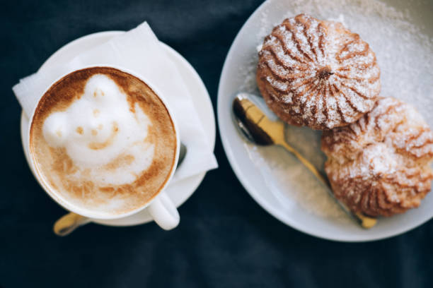 istock Fresh cappuccino art with plate with tasty cakes. 1158538355
