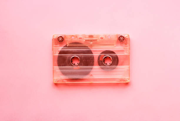 istock White retro audio cassette, close-up on a pink background, vintage concept. 1158539037