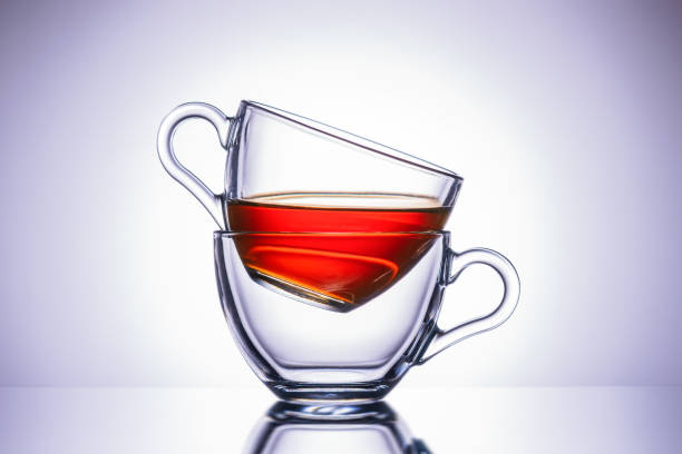 istock Two transparent mugs of tea. Central location, close-up. 1158540027