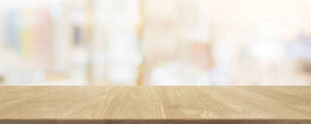 istock Empty wood table top on blur bokeh cafe and restaurent interior banner background - can be used for display or montage your products 1158540050