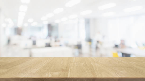 istock Empty wood table top and blur glass window wall in office building space interior background - can used for display or montage your products. 1158540071