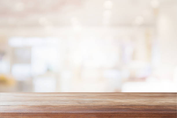 istock Empty wood table top on blur bokeh cafe and restaurent interior background - can be used for display or montage your products 1158540074