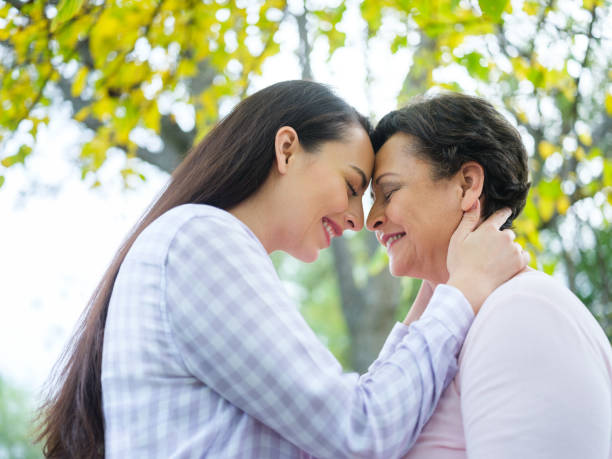 istock Joyful young woman holding her mother 1158540118