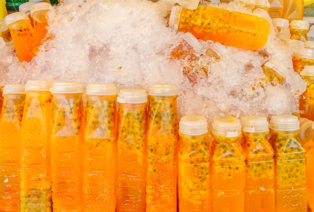 istock Passion fruit juice bottling units sold in the bazaar. 1158543272