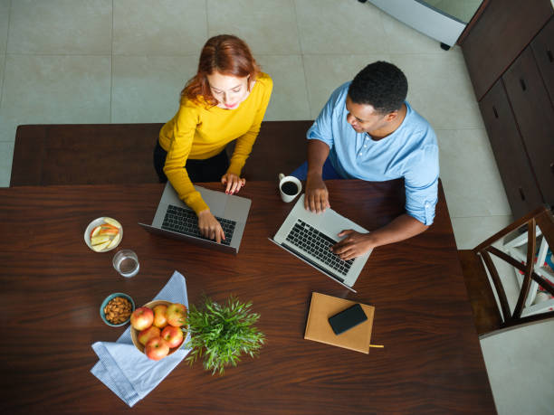 istock Man and woman working from home 1158543433