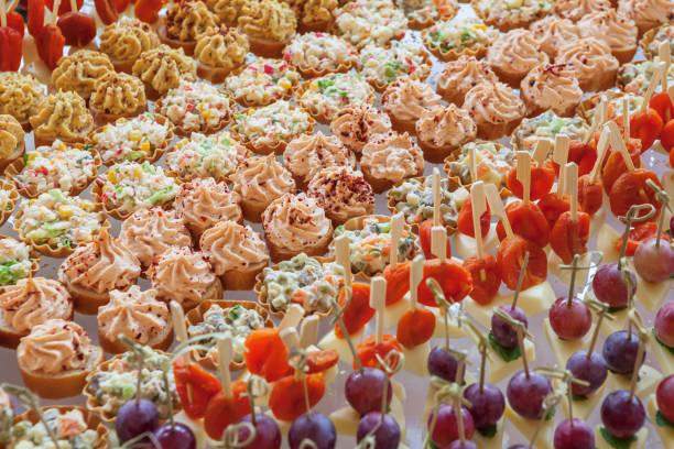 Snacks, cakes, salads, canapes on the table, texture, background