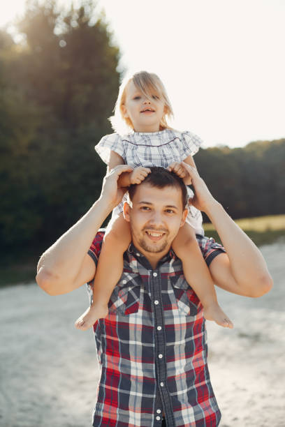 istock Father with daughter playing in a summer park 1158544305