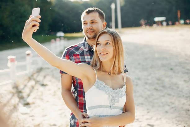 istock Beautiful couple spend time in a summer park 1158545056