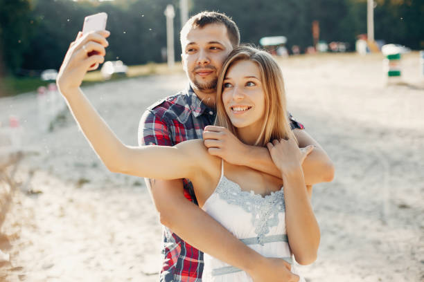 istock Beautiful couple spend time in a summer park 1158545057