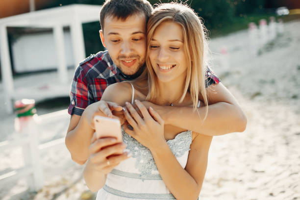 istock Beautiful couple spend time in a summer park 1158545070