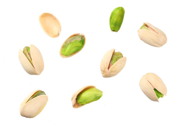 istock pistachio isolated on the white background. top view 1158547697