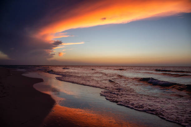 Beach in Varardero, Cuba Beautiful panoramic view of the sandy beach during a dramatic cloudy sunset. Taken in Varadero, Cuba. storm cloud sky dramatic sky cloud stock pictures, royalty-free photos & images