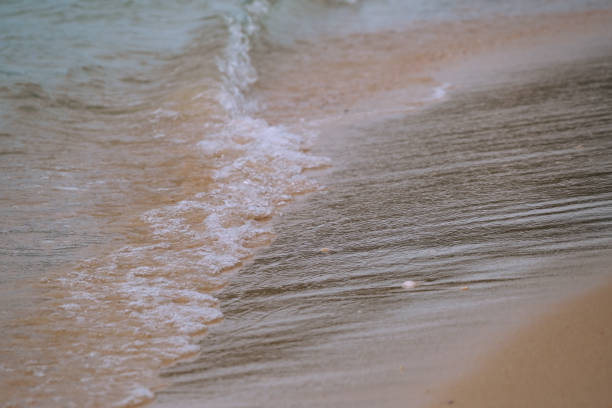 istock Beach with wave foam. Ocean water, sea surface 1158549986